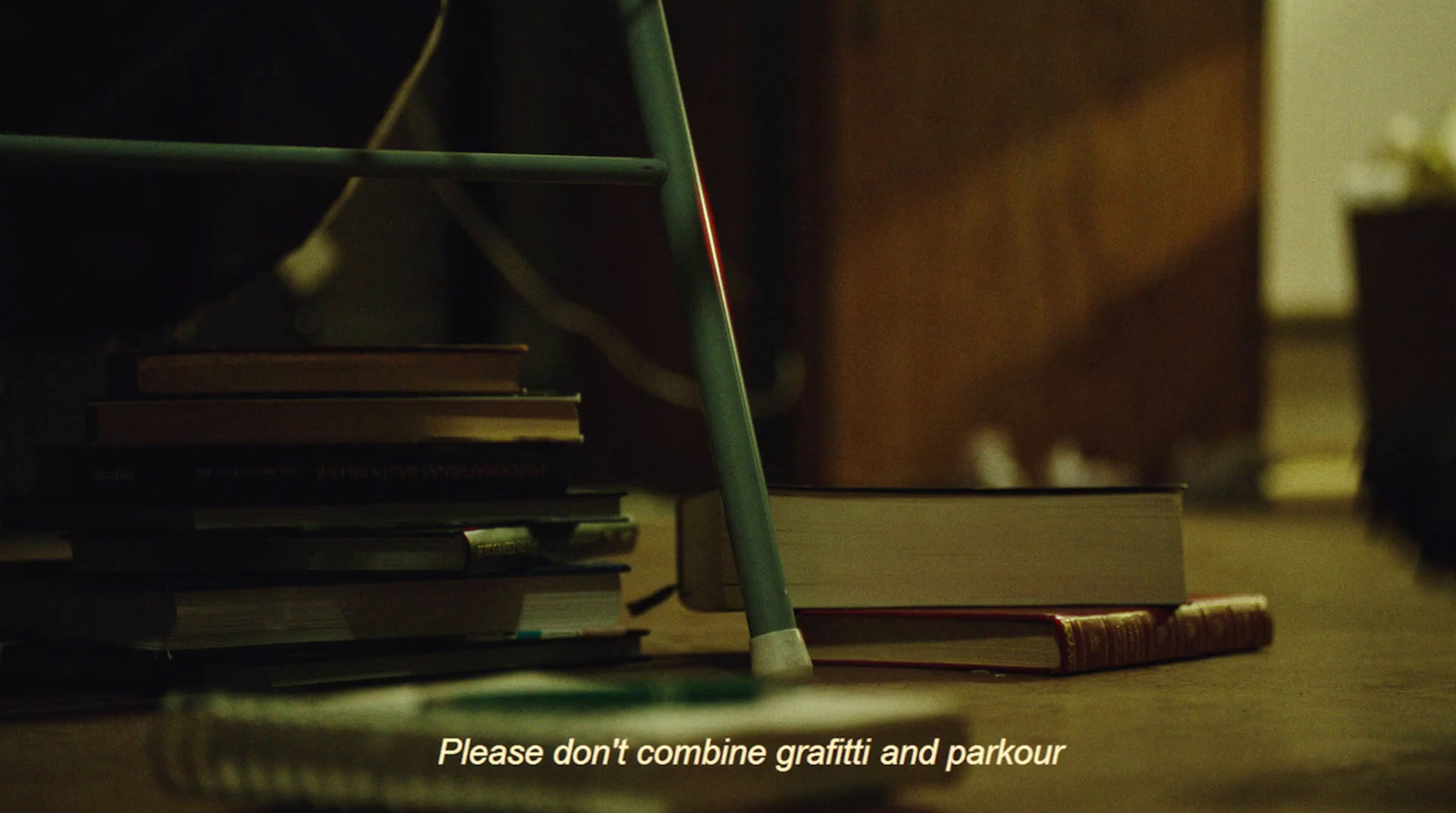 a pile of books sitting on top of a wooden floor