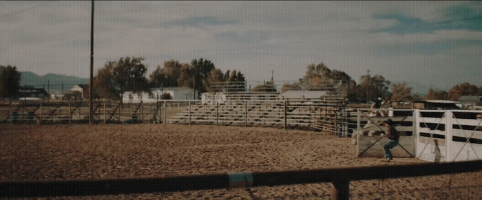 a man riding on the back of a white horse