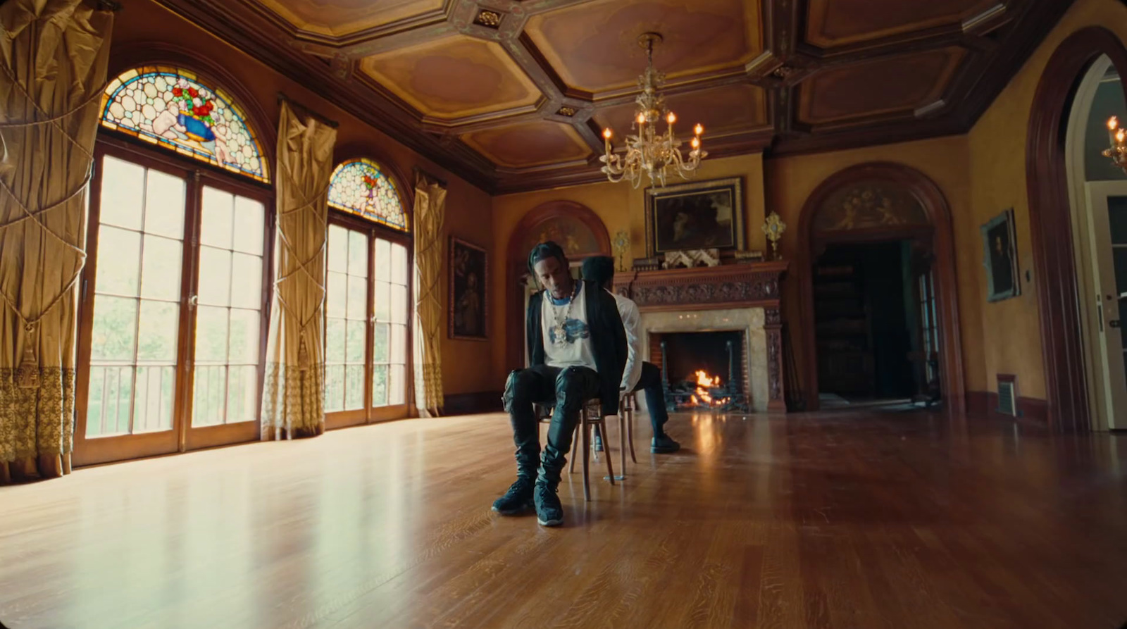 a man sitting on a chair in a large room