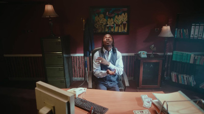 a man standing in front of a computer monitor