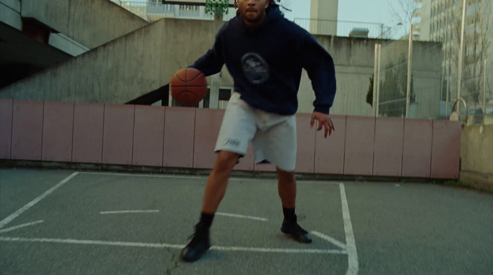 a man is playing basketball on a court