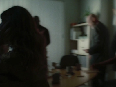 a blurry photo of a group of people in a room