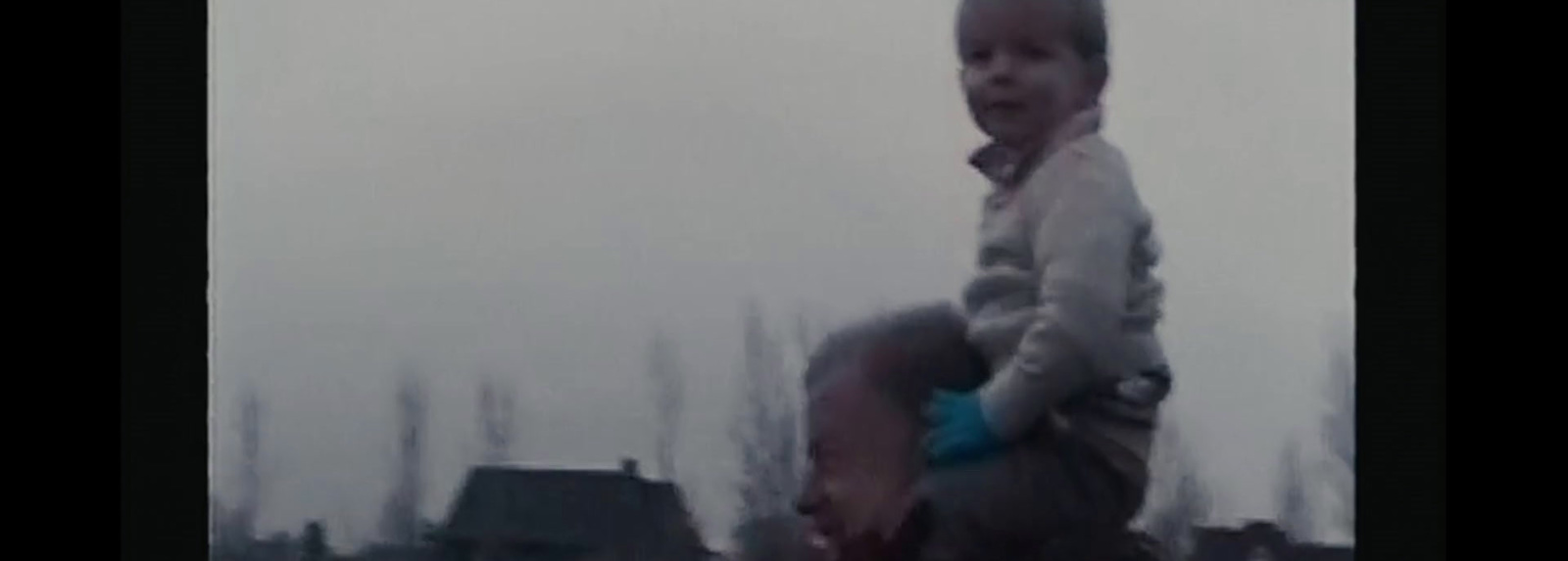 a young boy riding on the back of a horse