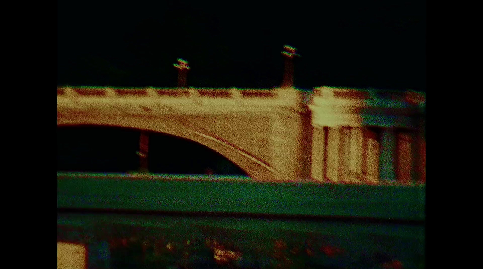 a bridge over a body of water at night