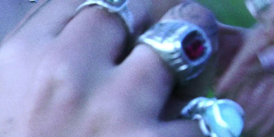 a close up of a person wearing a ring