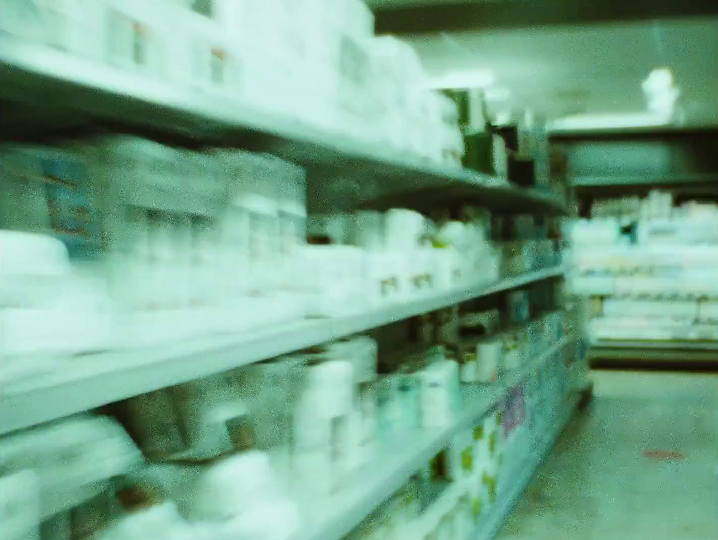 a blurry photo of a pharmacy store