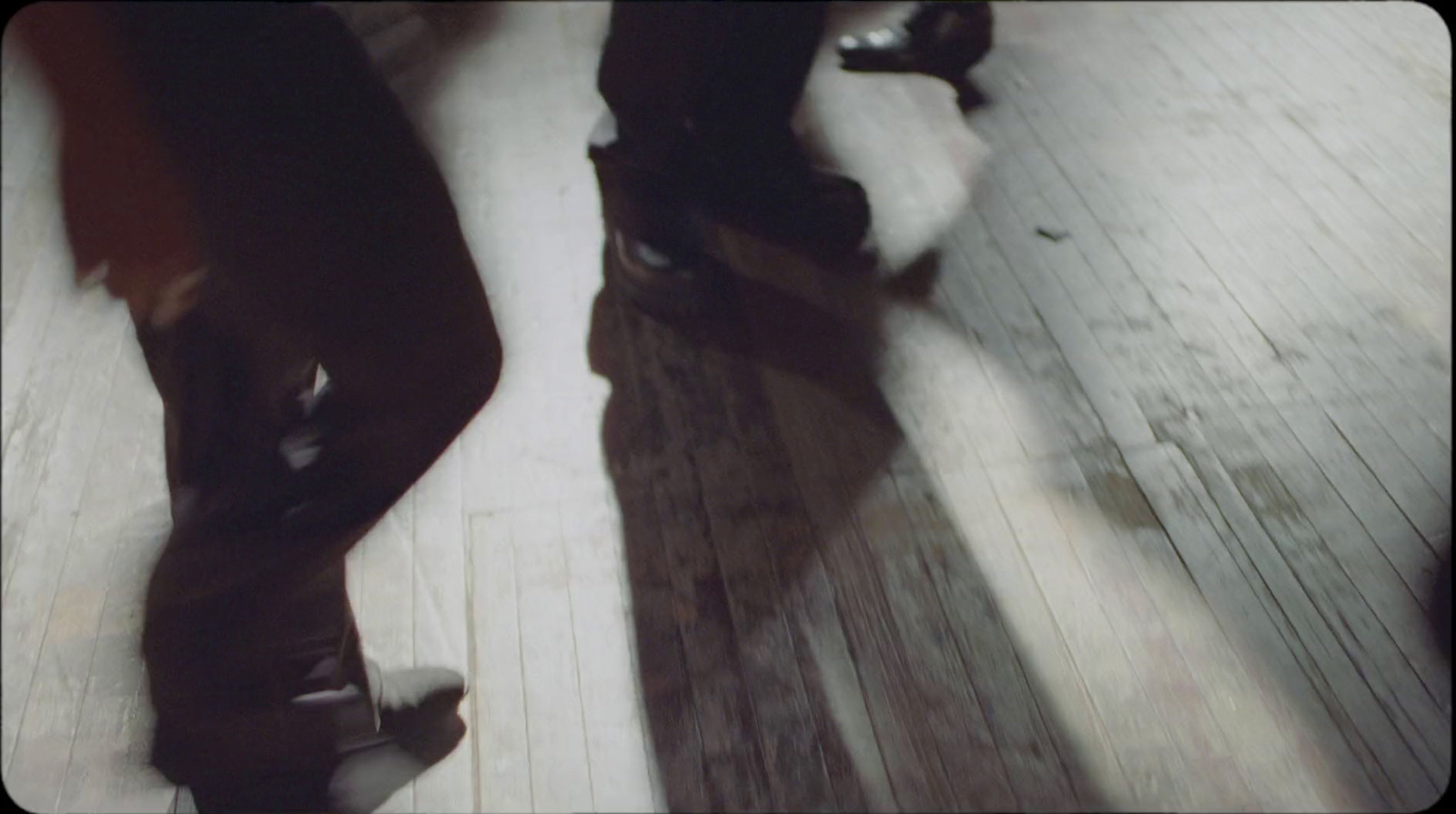 a close up of a person's feet on a skateboard