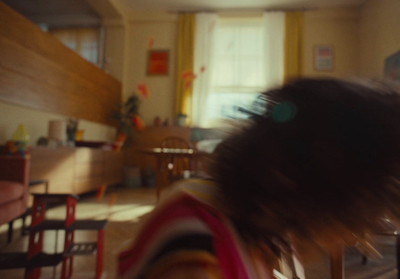 a blurry photo of a woman sitting at a table