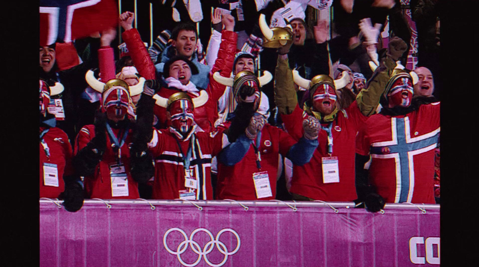 a large group of people wearing red and white outfits