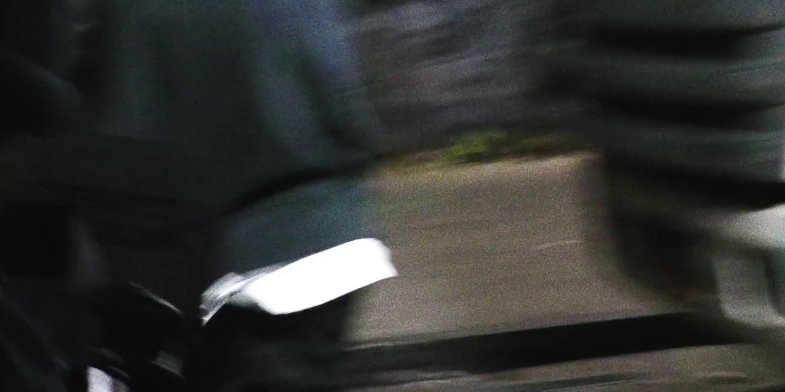 a blurry photo of a person riding a bike