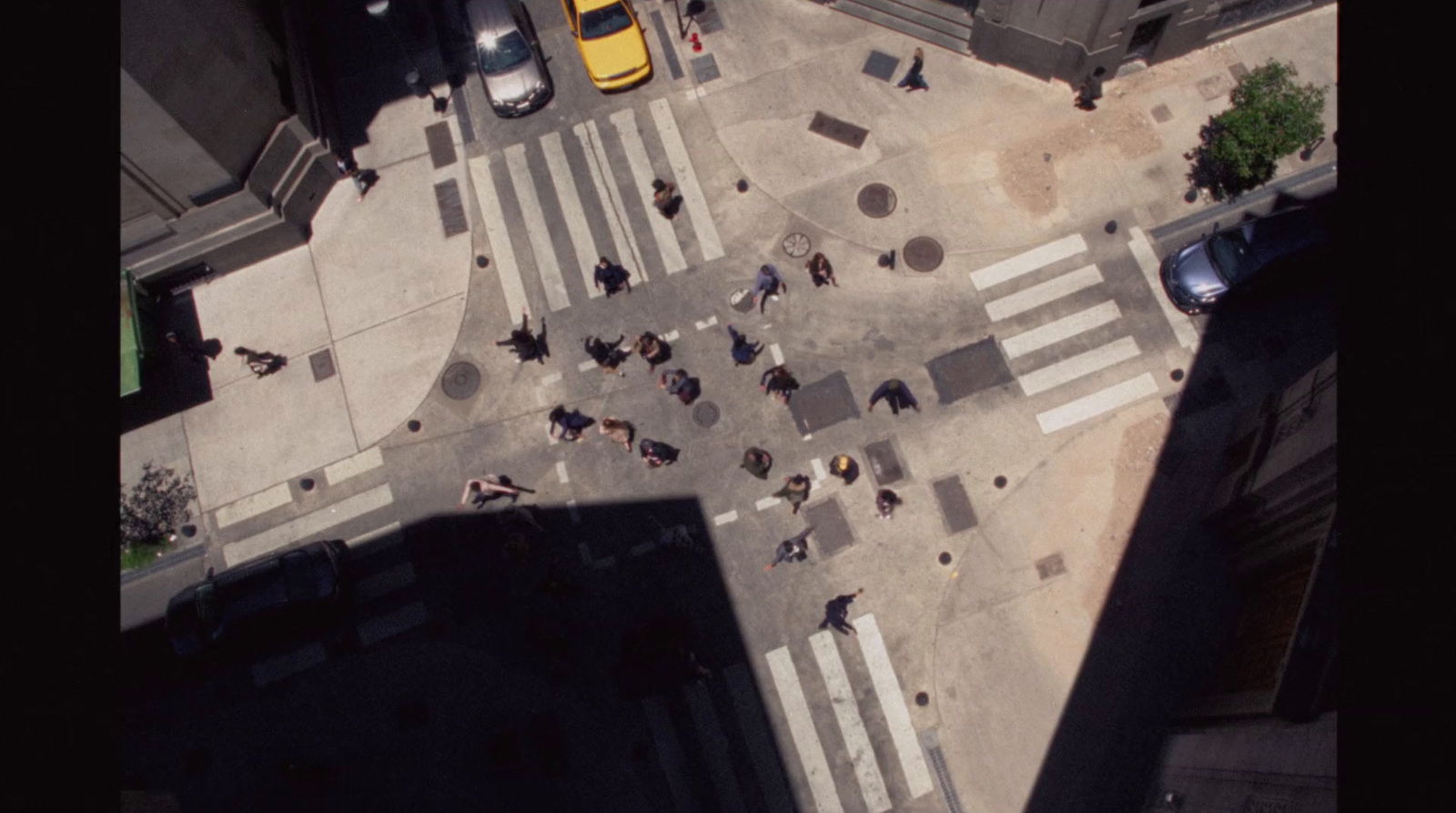 an aerial view of a crosswalk in a city