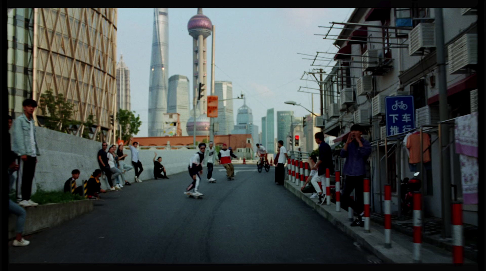 a group of people riding skateboards down a street