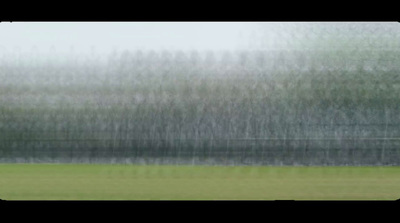 a blurry photo of a person walking in a field