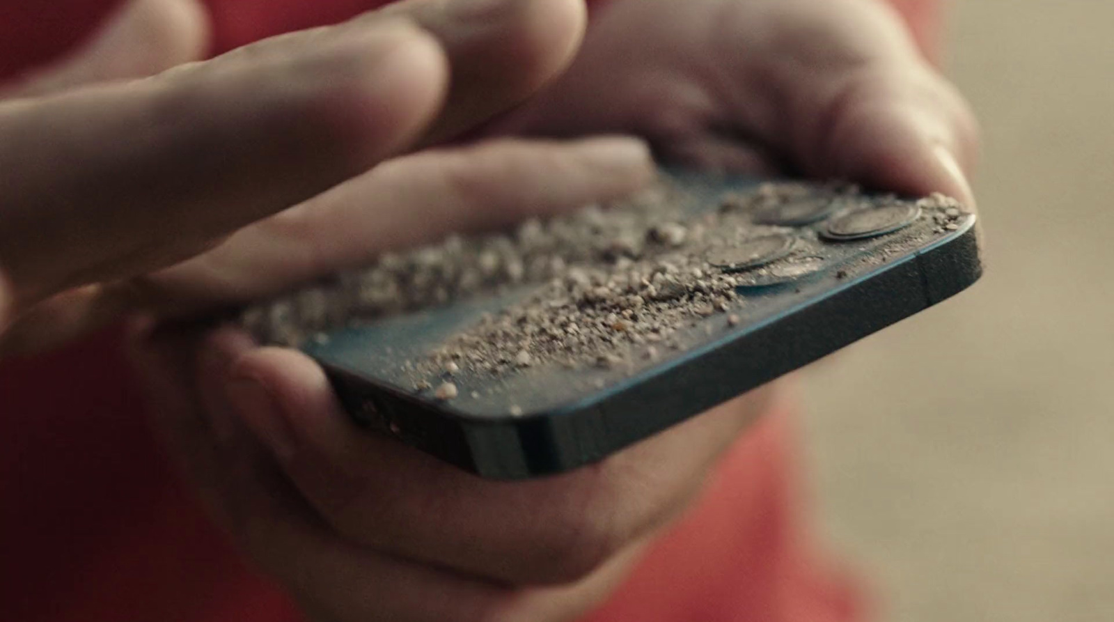 a close up of a person holding a cell phone