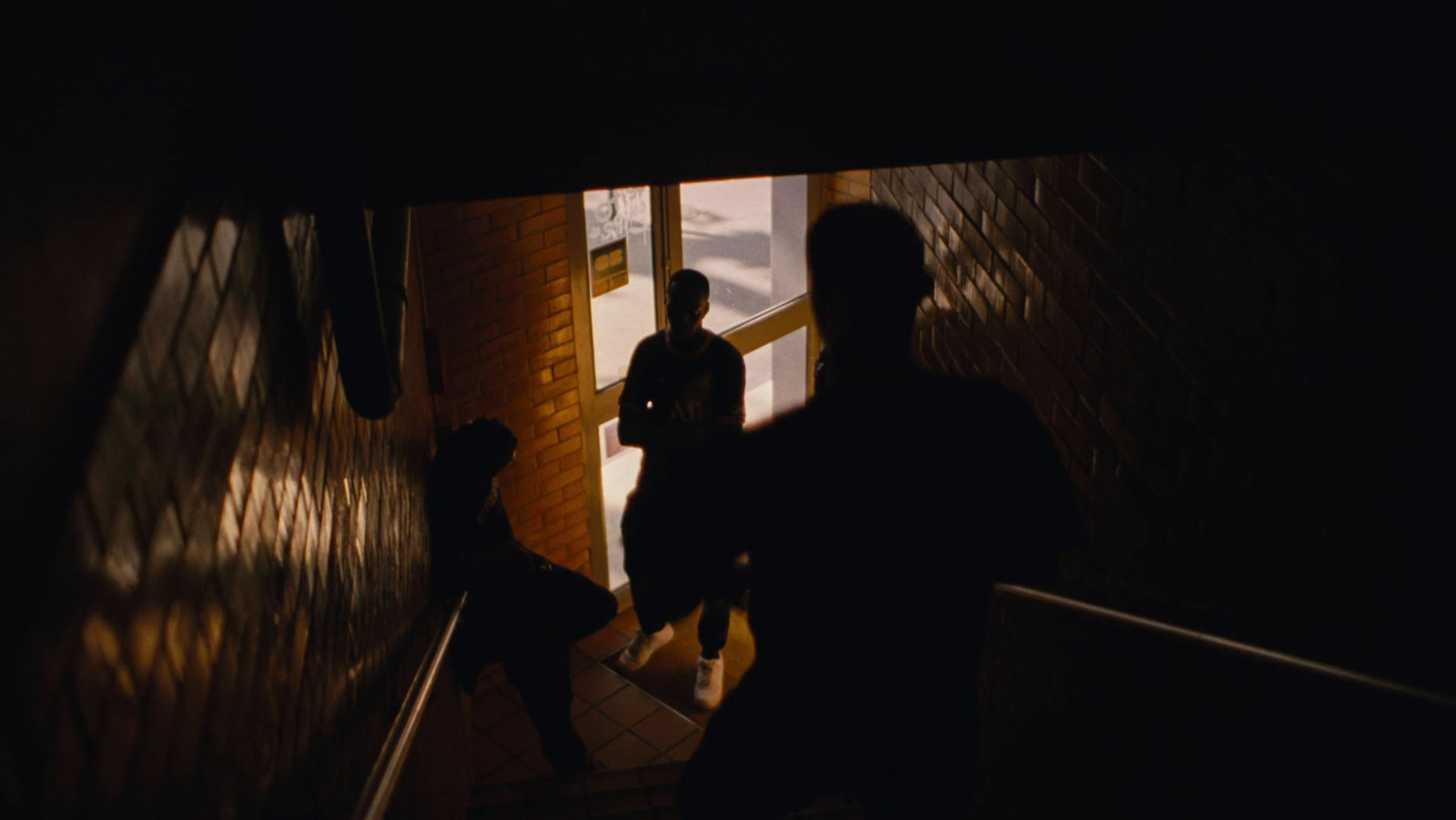 a group of people walking up a flight of stairs