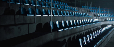 a row of chairs sitting next to a wall