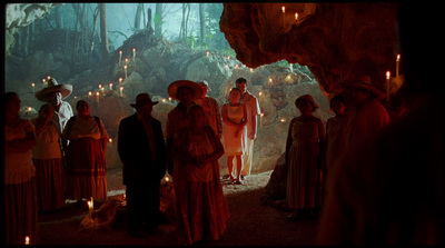 a group of people standing in a cave