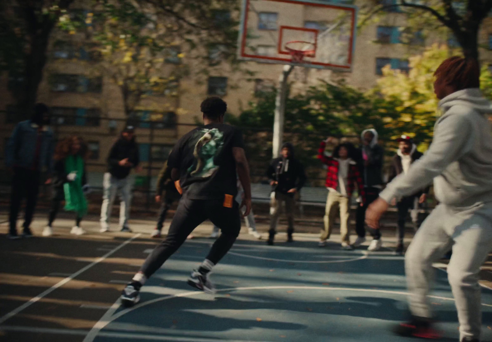 a group of young men playing a game of basketball