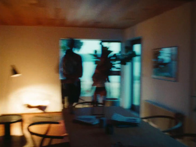 a blurry photo of two people standing in a living room