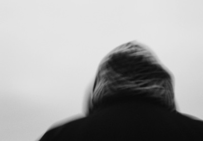 a black and white photo of a woman's back