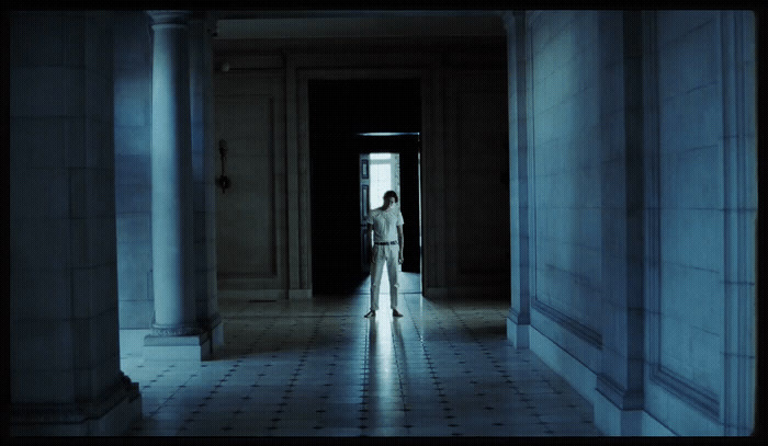 a woman standing in a doorway of a building