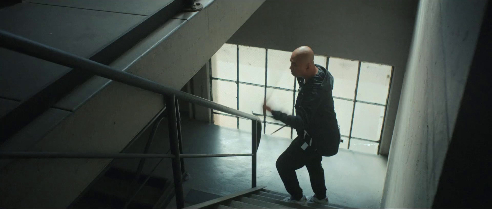 a man walking down a flight of stairs