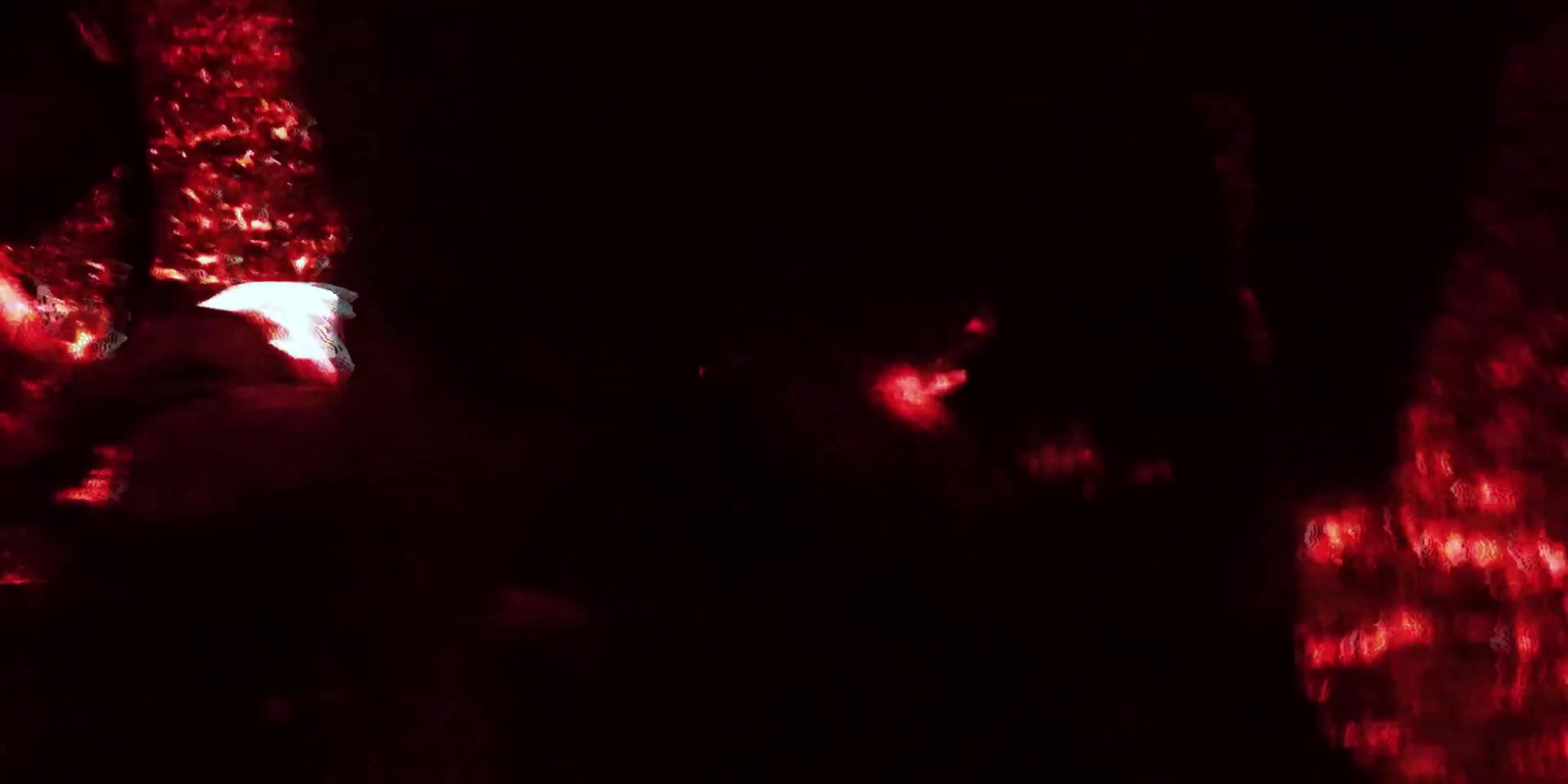 a blurry image of a person in a dark room