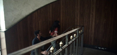 a couple of people that are standing on some stairs