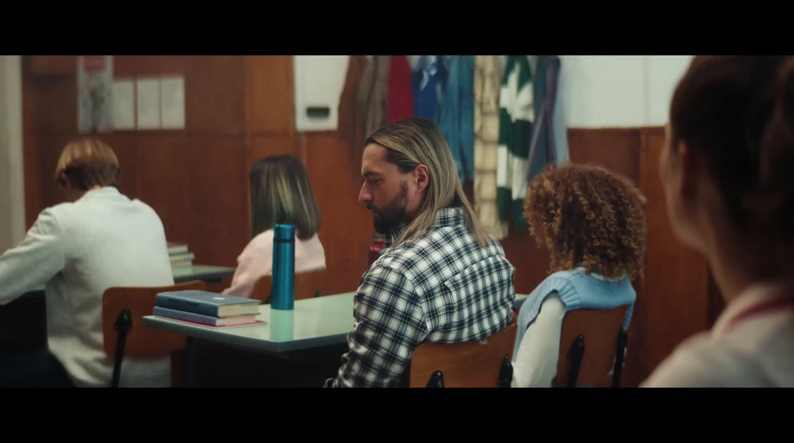 a group of people sitting around a table