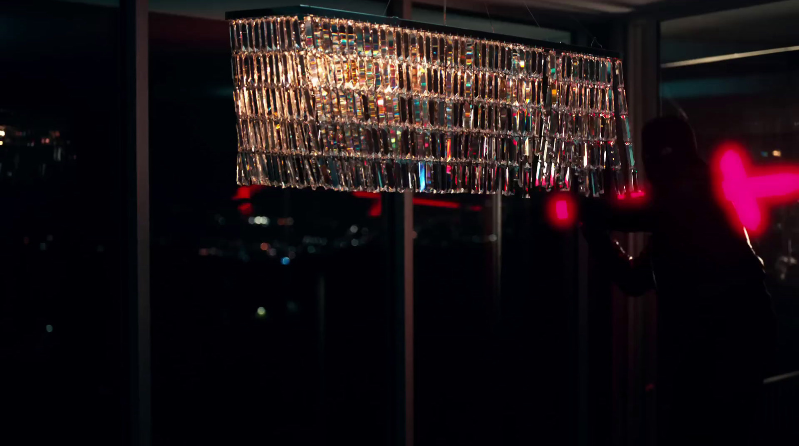 a chandelier hanging from the ceiling in a dark room