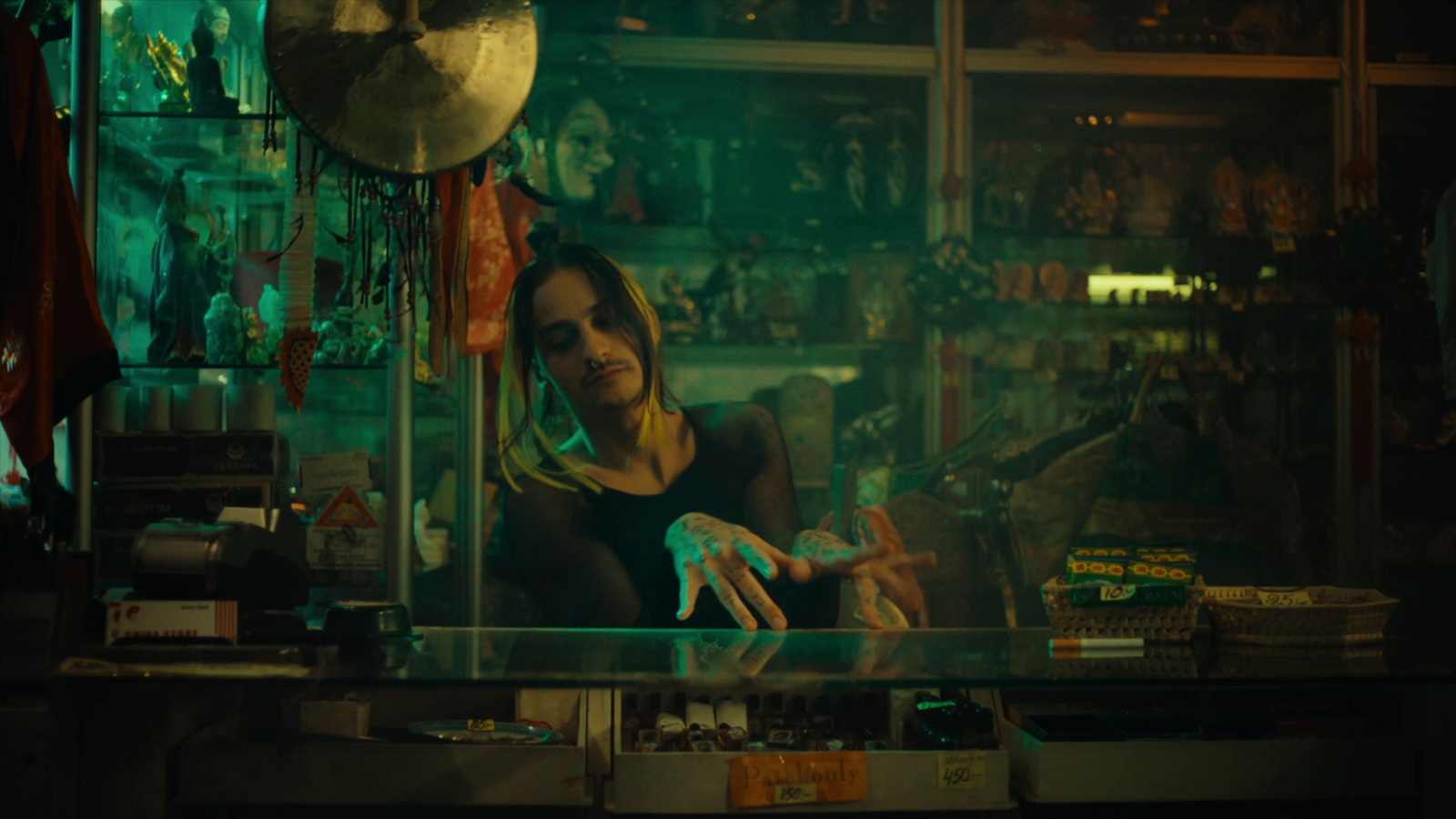 a woman sitting at a counter in a store