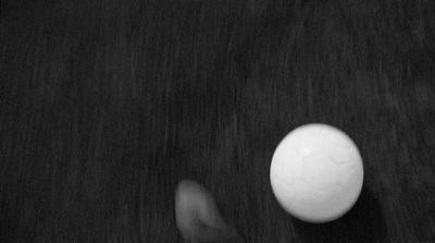 a black and white photo of an egg and a banana