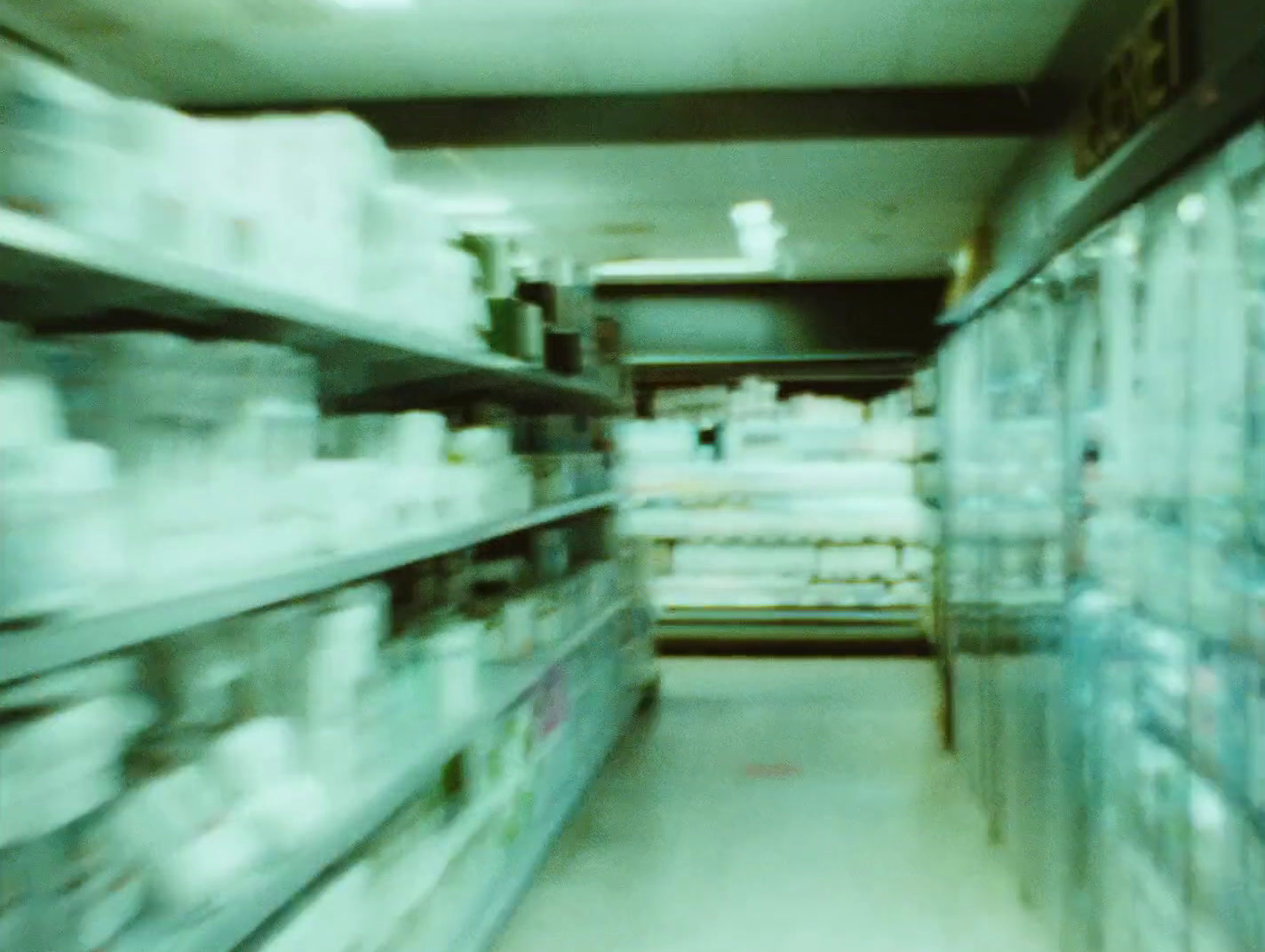 a blurry photo of a grocery store aisle