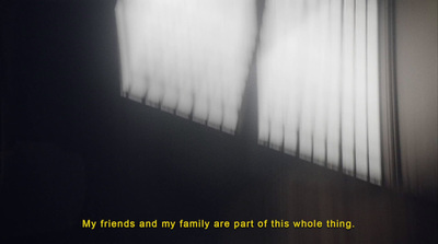 a black and white photo of a window with curtains