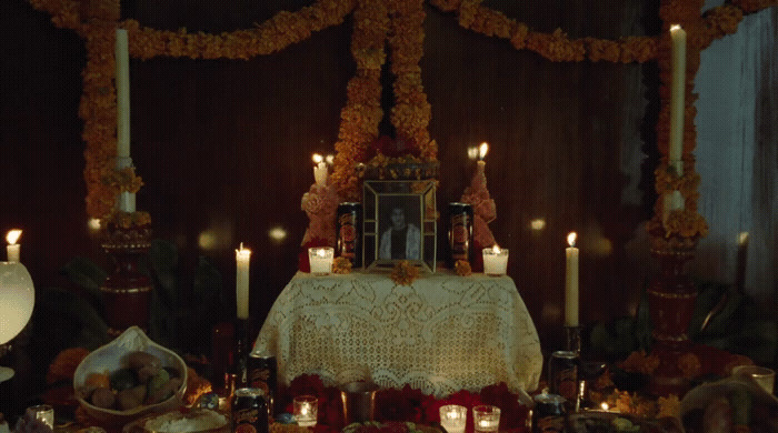 a table topped with candles and a table cloth