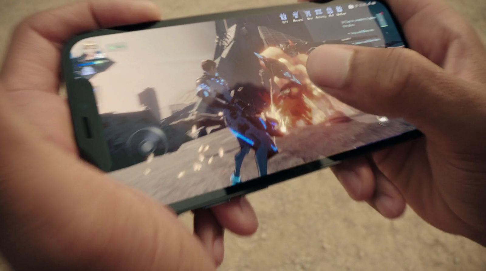 a person holding a cell phone with a video game on it