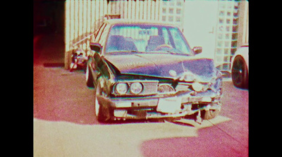 a police car parked in front of a tall building