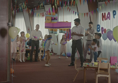 a man standing in front of a group of children