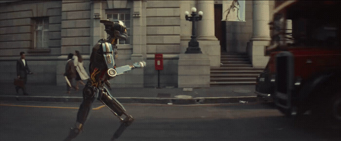 a man in a robot suit walking down a street