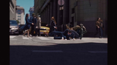 a group of people standing on the side of a road