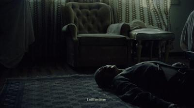 a person laying on the floor in a dark room