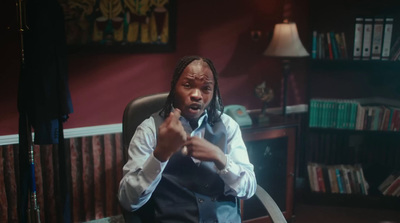 a man sitting in a chair in a room