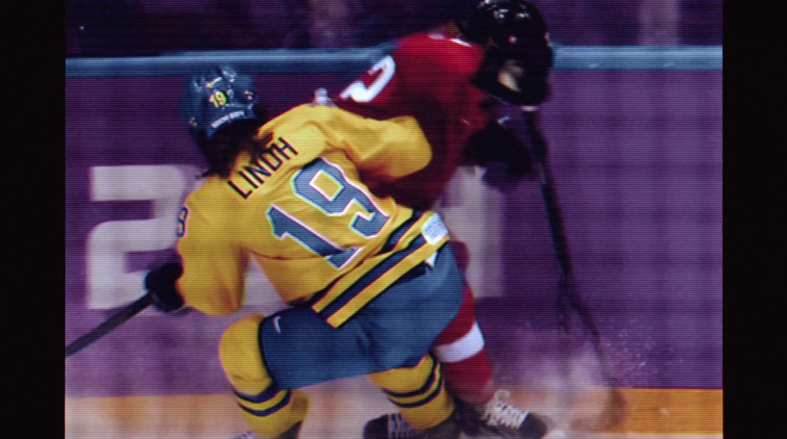 a couple of men playing a game of ice hockey