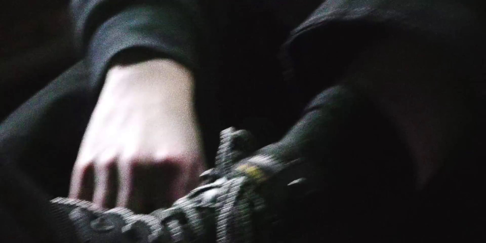 a close up of a person's hand holding a shoe