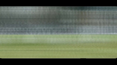 a blurry photo of a soccer ball on a field