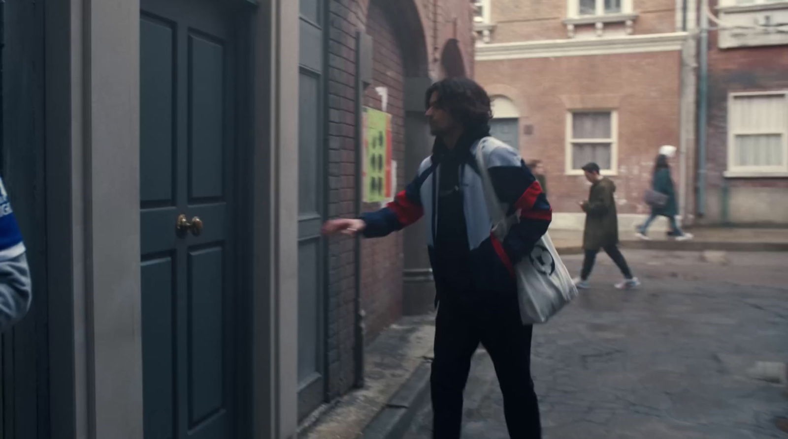 a man is standing outside of a building