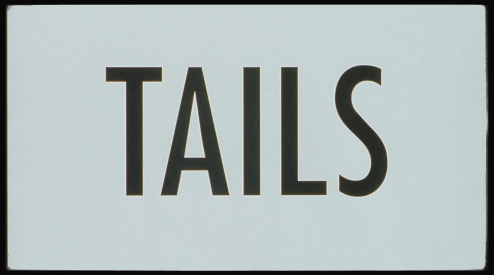 a close up of a sign with the word tails on it