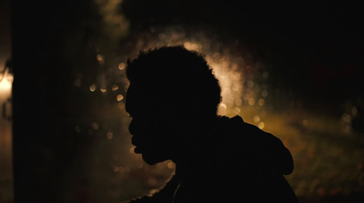 a silhouette of a person in the dark