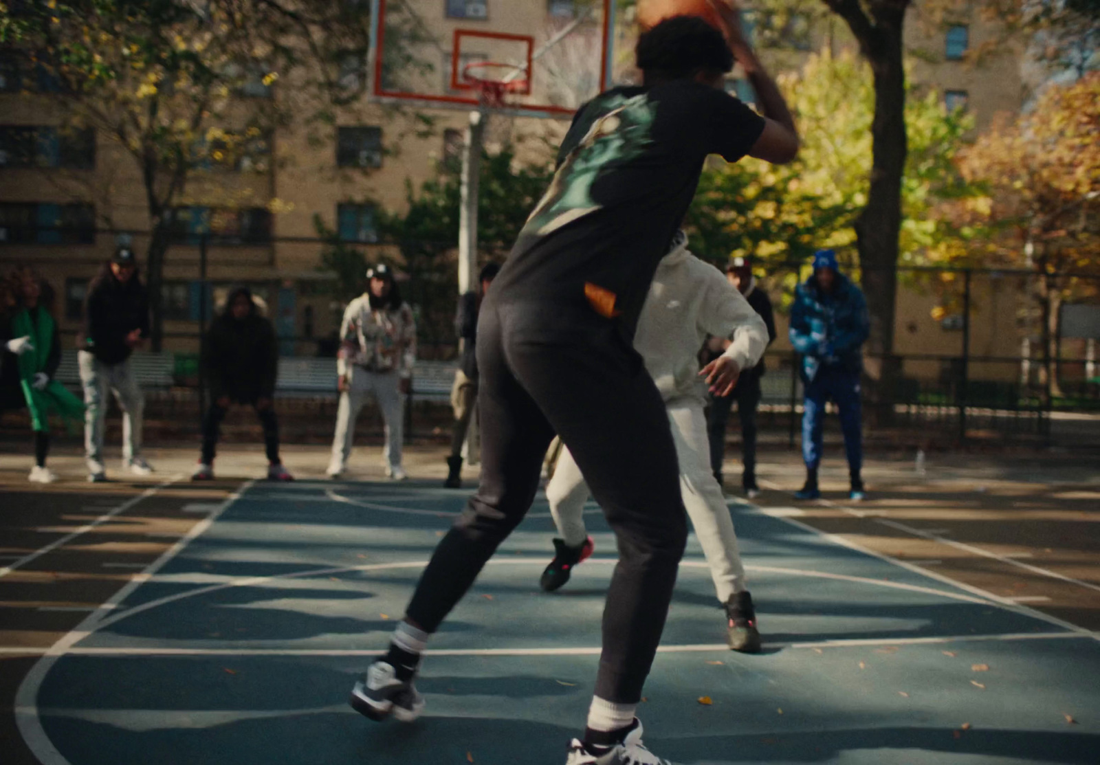 a group of people playing a game of basketball