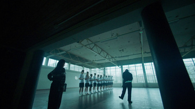 a group of people standing in a dark room